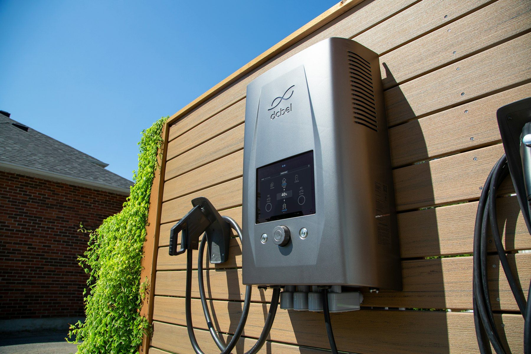 A wall-mounted electric vehicle charger