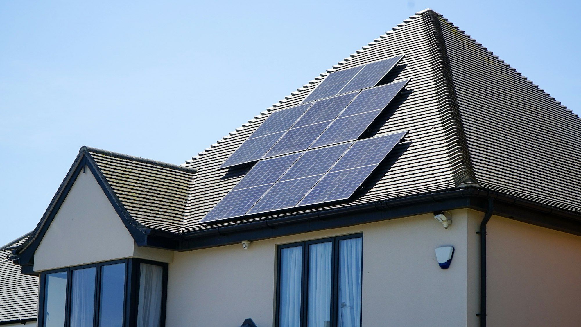 Solar panels installed across the roof of a two-storey home